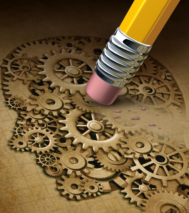 Brain function loss mental health concept as a symbol of dementia disease and a losing intelligence and memories as alzheimers as a medical an icon of neurology and thinking problems with a pencil erasing a human head made of gears and cogs.